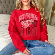 Detroit hockey team crewneck sweatshirt perfect for hockey fans and supporters. Gives off a sporty and spirited vibe, ideal for casual wear or game days. Relevant for hockey season and sports events. Product features - 50% cotton, 50% polyester fleece - 1x1 Ribbed collar, cuffs and bottom hem with spandex - Double-needle stitched for durability - Quarter-turned fabric to eliminate center crease - Regular fit Care instructions - Machine wash: cold (max 30C or 90F) - Do not bleach - Tumble dry: low heat - Iron, steam or dry: low heat - Do not dryclean Hockey Season, Hockey Team, Hockey Fans, Gameday Outfit, Hockey Teams, Sport Event, Halloween Shopping, Product Features, Crewneck Sweatshirt