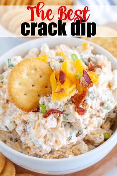 a white bowl filled with chicken salad and crackers