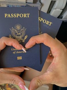 two people holding passports in their hands