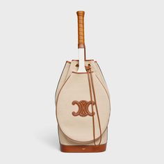 Celine Triomphe Tennis Bag in Textile and Calfskin - Natural / Tan | CELINE Celine Tennis, Tennis Inspiration, Tennis Racket Bag, Celine Triomphe, Tennis Bag, Fragrance Bottle, Basketball Ball, Retro Sports, Tennis Fashion