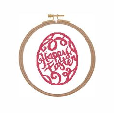 a cross stitch pattern with the words happy new year on it in red and white