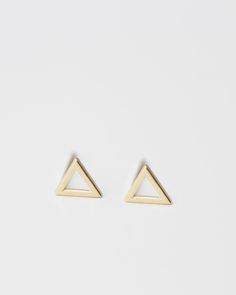 E&E PROJECT 14K SOLID GOLD SERIES ------------------------------------------------------ Basic but necessary! Lightest cute small Triangle earrings. Wear it while showering, swimming all day, everyday All earrings post and backings are 14K Gold 5mm tiny triangle studs / 1 Pair with 14K gold packings --------------------------------------- ■ SHIPPING UPGRADES You can find shipping upgrades options in the drop bar menu when you check out. * Within the U.S Regular First-class : 2-6 business day Gold Triangle Minimalist Earrings, Minimalist Gold Triangle Earrings, Triangle Yellow Gold Earrings For Gift, Minimalist Gold Earrings, Simple Studs, Triangle Stud Earrings, Minimalist Earrings Gold, Triangle Earrings Stud, Triangle Studs