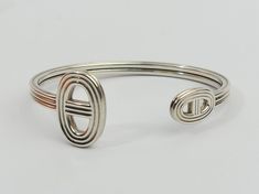 Item Description:- A genuine Hermes sterling silver Cuff Bangle.  It comes in the  Plush lined presentation box shown.         Size:-  6 1/2 inches/16.5 cm long - 4.5 mm wide. 160 grams.     Condition:- In fine condition.       Item Number:-  4104 - 070 Cromwells  Antique Centre is open from 10am - 5pm 7 days a week! For any questions or queries please telephone or email us -  Cromwells Antique Centre The Maltings, Station road Sawbridgeworth Hertfordshire CM21 9JX United Kingdom Phone: 01279722 Silver Cuff Bangle, Gold Wedding Rings, Sterling Silver Cuff, Cuff Bangles, Silver Cuff, Gold Wedding, Pottery Art, Bangle Bracelets, United Kingdom