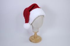 New classic cool toned red color! This Santa hat is crafted from a super soft plush faux sherpa fabric, making it the perfect accessory for all your holiday activities. Its cozy, warm texture will keep you comfortable whether you're out caroling, trimming the tree, or enjoying hot cocoa by the fire. Embrace the festive spirit while staying snug and stylish as you make holiday memories that last a lifetime. We do not accept returns or exchanges. We recommend hearing your head, and checking out our average head size chart below to help you determine your best size. We recommend choosing a hat that is 1-2" above your head measurement. We love custom orders! Please reach out via message if you would like a special size (while supplies last).  Hat Dimensions:  Adult L- 26" circumference Adult M Sherpa Fabric, Chula Vista, Fabric Making, Holiday Memories, Holiday Activities, New Classic, Cool Tones, Santa Hat, Soft Plush