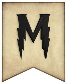 the letter m is made out of paper with lightning bolt cutouts on it's sides