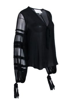 Indulge in this chic and playful Alexis blouse, crafted from luxurious black silk with a semi sheer finish. Its long sleeves and v-neckline add an elegant touch, while the tiered detail on the sleeves adds a flirty twist. Perfect for a dinner date, style it with wide leg pants and heels for a stunning look. Size M 100% Silk Unlined Pullover V-neckline Tiered ruffle detail on balloon sleeves Frayed hem neckline Bust 42" Waist 40" Shoulder to hem 25" Sleeve length 33" Fall Sheer V-neck Blouse, Party V-neck Blouse With Blouson Sleeves, Sheer Silk Long Sleeve Blouse, Sheer V-neck Top For Formal Occasions, Black Blouse With Sheer Long Sleeves, Black Sheer Silk Tops, Black V-neck Blouse With Sheer Sleeves, Sheer Sleeves V-neck Blouse For Party, Evening V-neck Top With Sheer Sleeves