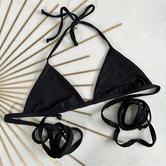 Brand New Never Worn. Brand Marked To Prevent In Store Returns. Black Strappy Swimwear For Sunbathing, Solid Color Triangle Top For Sunbathing, Black Triangle Top Swimwear For Summer, Black Strappy Swimwear For Summer, Solid Halter Top With Built-in Bra For Beach Season, Black Beachwear Halter Top With Adjustable Straps, Black Adjustable Halter Top For Beachwear, Summer Black T-back Swimwear, Black Triangle Top Swimwear For Vacation