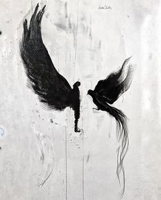 two black birds flying next to each other on a white wall with blue writing underneath