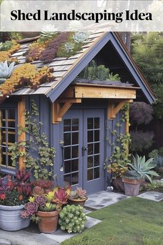 an outdoor shed with plants growing on the roof and windows, in front of it