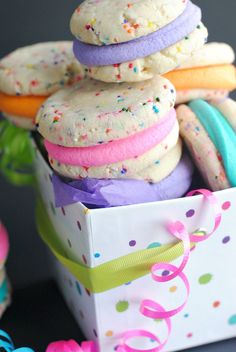 a box filled with lots of colorful cookies