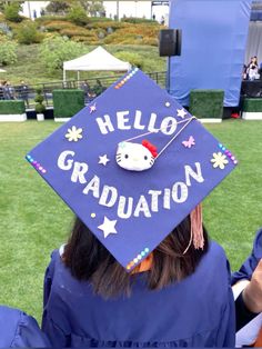 a person wearing a hello kitty graduation cap with the words hello graduation written on it