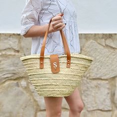 Custom beach bag is a woven basket bag with initial perfect as a gift for women.  Personalized straw bag with leather is handcrafted with natural straw and combined with high quality leather, making it a beautiful beach bag for women. Very versatile, this custom straw bag is perfect anytime and everywhere, you can use it as beach bag, for shopping, for the pool, for go to the grocery, etc. Finally, you can use your straw bag for everyday use, always with style and authenticity. It can be a beautiful gift for women as a gift or for yourself.  This basket bag can be customized with your initial engraved on the leather, whichever you choose and, without extra charge. We can engrave just the initial directly on the leather, or engrave the initial with silver finish. Indicate it in the menu opt Summer Tan Straw Bag With Braided Handles, Summer Beach Straw Bag In Tan, Summer Tan Straw Bag For Beach, Tan Straw Bag With Braided Handles For Beach, Summer Vacation Tan Straw Bag, Rectangular Tan Straw Bag For Vacation, Tan Rectangular Straw Bag For Vacation, Tan Straw Tote Bag For Vacation, Travel Straw Bag With Leather Handles In Tan