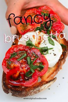 a close up of a sandwich with tomatoes and mozzarella on it, text reads fancy bruschto