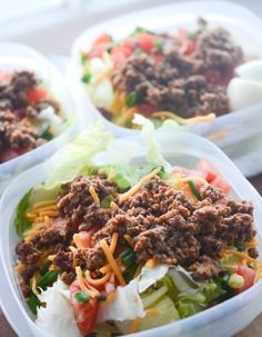 three plastic containers filled with food on top of a table