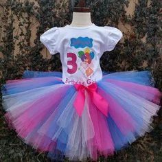 This Peppa Pig Tutu Set is perfect for your little one's special day! It features a 100% cotton shirt and a premium tulle tutu in a rainbow of colors. Make their birthday extra special with this charming outfit. Playful Purple Tutu Dress For Birthday, Fun White Tutu Dress For Birthday, Playful Tulle Tutu Dress For Birthday, Pink Tulle Tutu Dress For Playtime, Spring Birthday Tutu Dress With Short Sleeves, Short Sleeve Tutu Dress For Spring Birthday, Spring Short Sleeve Tutu Dress For Birthday, Cute White Cotton Tutu Dress, White Fitted Cotton Tutu Dress