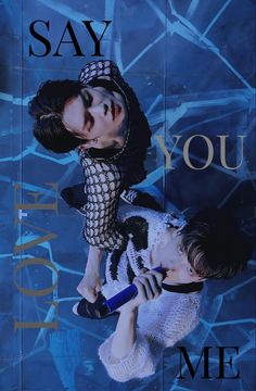 two people standing next to each other in front of a blue background with the words say you me