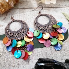 These boho chandelier earrings add a burst of colorful boho style to any outfit! Your choice of Copper or brass filigree crescents that hold a stunning chandelier of colorful shells that whimsically move with you. Simply stunning pair of boho shell earrings that will have you feeling gorgeous inside and out! - Antiqued copper filigree - Real shells - Copper Or Brass filigree earring settings - Dramatic 3 inch long length - Boho Beach bride wedding jewelry PERFECTION! 2016©Wanderlust Hearts desig Bohemian Dangle Earrings For Beach, Bohemian Shell Earrings For Gift, Bohemian Chandelier Earrings With Ear Wire For Festivals, Summer Multicolor Shell Jewelry, Bohemian Shell-shaped Earrings For Gift, Multicolor Shell Jewelry For Festival, Bohemian Multicolor Shell-shaped Jewelry, Colorful Bohemian Jewelry For Summer, Multicolor Bohemian Jewelry For Summer