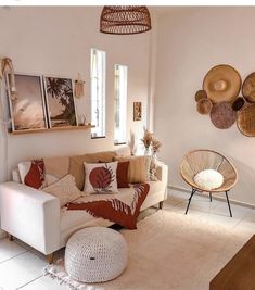 a living room filled with lots of furniture next to a wall mounted wicker art