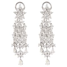 Absolutely stunning vintage high jewelry chandelier earrings, with a very Harry Winston look. Approximately 15.80 carats of pear, marquise and round brilliant diamonds. Approximately H/I color grade and VS clarity grade. White gold, 19.53 grams, 2.5in. Accommodated with an up to date appraisal by a GIA G.G., please contact us with any questions. Thank you. Item Number E3992 Red Chandelier, Diamond Chandelier Earrings, Diamond Chandelier, Silver Chandelier Earrings, Gold Chandelier Earrings, Silver Chandelier, Harry Winston, Gold Chandelier, Marquise Diamond