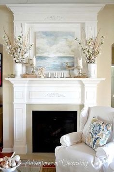 a living room filled with furniture and a fire place under a painting on the wall