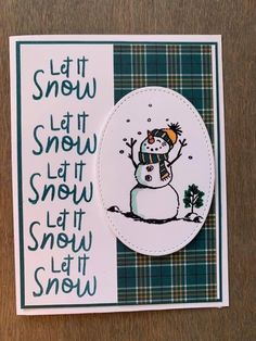 a card with a snowman on it and the words let it snow written in green