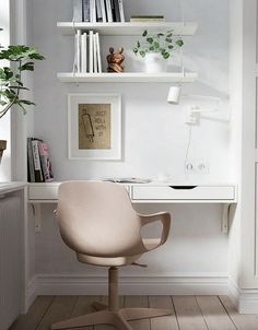 a white desk with a chair and bookshelf in the corner next to it