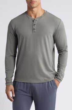 The always appealing henley is even better when made from a soft and stretchy knit that features sun protection. Button half placket Crewneck Long sleeves UPF 50+ sun protection 46% viscose, 46% polyester, 8% spandex Machine wash, line dry Imported Summer Henley With Button Closure, Casual Solid Henley With Buttons, Casual Gray Top For Relaxation, Casual Solid Color Henley For Loungewear, Henley Neckline Tops With Button Closure For Loungewear, Casual Henley With Buttons For Loungewear, Casual Lightweight Long Sleeve Tops, Upf 50, Sun Protection