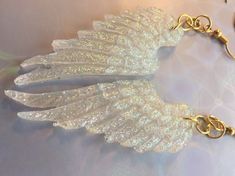 Handcrafted from resin ,mica, and glitter. These beautiful guardian angel wings can be custom colours with choice of wing base and glitter colour. Comes with gold or silver earring hooks. Gardian Angel, Angel Wings Earrings, Guardian Angel Wings, Wings Earrings, Acrylic Nail Set, Angel Wing Earrings, Crystal Angels, Beautiful Angel, Wing Earrings