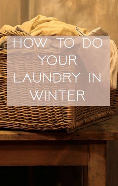 a wicker basket sitting on top of a wooden table with the words how to do your laundry in winter