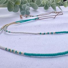 A beautifully dainty adjustable silk necklace with tiny turquoise and gold seed beads. Wear it solo or layer with others to create your unique bohemian look. It's the perfect addition to your summer accessories and a popular beach necklace.  we recommend layering with our Tiny Turquoise seed bead necklace: https://precioushippieuk.etsy.com/listing/1263330156 Handthreaded on quality silk cord (beige colour) and secured with a 14k Gold filled slider bead. at its shortest this necklace is 16inches, Adjustable Gold Turquoise Necklace With Round Beads, Gold Turquoise Necklace With Round Beads, Adjustable Multi-strand Turquoise Necklace Gift, Turquoise Lariat Beaded Necklaces, Adjustable Multi-strand Turquoise Necklace With Colorful Beads, Adjustable Gold Turquoise Beaded Necklace, Adjustable Tiny Beads Lariat Necklace, Adjustable Turquoise Beaded Necklaces, Turquoise Multi-strand Beaded Necklaces