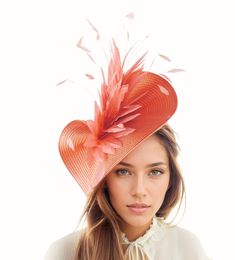 Hats By Cressida Kentucky Derby & Ascot Fascinator Hats Coral Orange Amy Kentucky Derby Fascinator Free form coral orange base trimmed a large spray of coral orange hackle and coque feathers Base measures 14 inches wide Mounted with a matching headband. If you prefer a headband to match your hair, please make a note at check out what colour headband you want. This feather fascinator is perfect for the Kentucky Derby, Royal Ascot, weddings,tea party,ladies luncheon and other formal occasions.  De Kentucky Derby Fascinator, Party Ladies, Ladies Luncheon, Derby Fascinator, Feather Fascinator, Base Trim, Cocktail Formal, Wedding Tea, Feather Fascinators