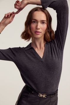 A sweater silhouette designed for versatility and enduring style. Featuring a classic collar with a V-neck for a touch of femininity, this sweater offers both comfort and sophistication. With its long sleeves and a ribbed knit texture, the sweater is ideal for all types of weather and perfect for layering. It's a wardrobe essential that effortlessly transitions from season to season. Product DetailsModel 5'10" wearing a size SMaterials: 90% Wool 10% CashmereCare: Dry Clean Only Elegant Fitted Ribbed V-neck Sweater, Chic V-neck Polo Sweater For Fall, Fitted V-neck Sweater With Ribbed Cuffs For Fall, Fitted V-neck Polo Sweater With Seamless Collar, Elegant Long Sleeve V-neck Sweater For Winter, Fitted Cashmere V-neck Sweater For Work, V-neck Polo Sweater For Work, Elegant Cashmere V-neck Sweater With Ribbed Cuffs, Classic V-neck Top With Ribbed Collar