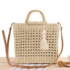 Expertly crafted with high-quality woven straw, the Straw Bag Beach Hollow Woven Bag is a must-have for any beach-goer. Its sturdy design and spacious interior make it perfect for carrying all your essentials, while the chic and stylish look is sure to elevate any outfit. Stay organized and fashionable with this versatile bag. This women's beach bag is crafted with unique hollow woven straw design, perfect for a day at the beach. Its spacious interior and sturdy handles make it ideal for carrying all your essentials. Constructed with durable materials, this bag is both stylish and functional. Beach Tops Summer, Straw Beach Bag, Woven Rattan, Top Handle Handbags, Crossbody Tote, Travel Tote, Woven Bag, Large Bag, Wooden Handles