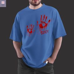 Prepare to stand out this Halloween with our "Boo" Bloody Handprints T-Shirt, perfect for horror enthusiasts and anyone who loves a good scare. This graphic tee features realistic bloody handprints and a bold "Boo!" text, making it the ultimate statement piece for Halloween parties, haunted house visits, trick-or-treating, or just embracing the spooky fall vibes. It's designed to keep you comfortable while turning heads, so grab yours now and bring the Halloween spirit wherever you go! Spooky Long Sleeve T-shirt With Custom Print, Spooky Relaxed Fit Screen Print T-shirt, Halloween Horror T-shirt With Screen Print, Horror T-shirt With Sublimation Print For Halloween, Halloween Horror Cotton T-shirt, Spooky Fall, Trick Or Treating, Halloween Parties, Halloween Spirit