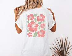 Step into summer with this charming Hibiscus Flower Beach T-Shirt! Designed to evoke tropical vibes and laid-back beach days, this tee features a vibrant hibiscus flower print that will instantly uplift your wardrobe. Made from soft and breathable fabric, this t-shirt is perfect for both lounging by the beach or casual outings with friends. Add a touch of island paradise to your style with this must-have summer essential! 🖤 Comfort Colors introduces the "Comfort Colors 1717" garment-dyed t-shir White Hibiscus Print T-shirt For Spring, Hawaiian Graphic Print Camp Shirt For Beach Season, White Printed Camp Shirt For Beach Season, Tropical Hawaiian Shirt With Sublimation Print For Beach, White Hawaiian Shirt With Sublimation Print For Beach, Beach Season Hawaiian Shirt With Sublimation Print, Sublimation Print Hawaiian Shirt For Beach Season, White Tropical T-shirt For Beach Season, Hawaiian Top With Sublimation Print For Beach Season