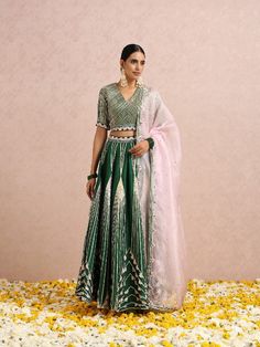 Featuring an emerald green lehenga with gotawork placed in symmetry and hand embroidered folded sequins and beads. It comes with an embroidered blouse and a baby pink embroidered silk organza dupatta. Color: Emerald green and Baby Pink Fabric: Lehenga & Blouse - Silk base Dupatta - Silk Organza Note: The product will be shipped within 30-35 days of order placed Wash care - Dry Clean Only. Do not use heavy Iron Pink Colour Lehenga, Emerald Green Lehenga, Green Lehenga, Blouse Silk, Baby Pink Colour, Lehenga Blouse, Organza Dupatta, Silk Lehenga, Silk Organza