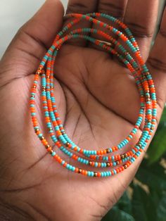 "~OBAA SWEETIE~ Handcrafted waist beads for ALL body types. These waist beads are designed to be tied on for long term wear. Obaa means \"woman\" in the Akan language of Ghana, translating Obaa Sweetie to \"Sweet woman.\" The color turquoise represents self-awareness. Orange symbolizes courage and vitality, and bronze exudes nature's aura and ideas of growth and strength. This listing is for ONE WAIST BEAD STRAND PER QUANTITY PURCHASED. Bead size 11 (small), giving off a dainty look. Know your m Tiny Beads Strand For Festival, Bohemian Waist Beads For Summer Beach, Bohemian Waist Beads For Beach In Summer, Bohemian Tiny Beads Waist Beads For Festival, Festival Beaded Strand Necklace With Tiny Beads, Festival Beaded Necklace With Tiny Beads Strand, Bohemian Beaded Chain Waist Beads, Colorful Heishi Beads For Festival, Festival Strand Necklace With Tiny Beads