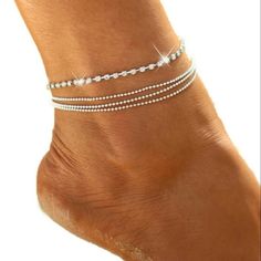 Silver Rhinestone Tennis Anklet 4 Tier Layers; 1 Rhinestone Strand & 3 Beaded Strands. This Beautiful Anklet Is Supposed To Be Sterling Silver Filled/Plated. & Should Be Cared For As So. See Photos For Details. Colors May Vary Due To Screen Differences & Lighting. Anklet/Bracelet Extends From 21cms Upto 26cms Check Out My Closet! More Like This & Hundreds Of New & Preloved Items! Bundle & Save With Combined Shipping! All Items Must Be Bundled Together. Once You Agree To An Offer You Cannot Add More Items. Please Bundle & Send Me A Reasonable Offer, I Will Either Accept Or Counter. Foot Layer Beads Jewelry Females Women Womens Ladies Ladys Girls Bangle Bracelet Sparkle Sparkles Sparkly Twin Adjustable Silver Rhinestone Anklets, Summer Elegant Rhinestone Anklets, Elegant Beaded Metal Anklet, Adjustable Metal Anklets With Rhinestones, Tennis Anklet, Beautiful Anklet, Diamond Bling, Contemporary Chic, Bead Chain