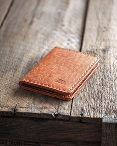 Ranch wallet is a leather bi-fold wallet that is compact yet spacious. You can carry up to 12 cards inside with folded cash. Its rugged leather feels (and smells) good and serves time well with sustainability and patina-wise. Turn your everyday life into luxury with this handmade leather wallet that is crafted with passion in the middle of the forests in Finland. There are many color and color combinations available to this wallet but if you want something more unique don't hesitate to contact m Rugged Leather, Handmade Leather Wallet, Clip Wallet, Leather Bifold Wallet, Leather Wallets, Money Clip Wallet, Everyday Luxuries, Wallet Card, Fold Wallet