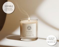 a candle is lit on a white surface with the label below it that reads, editable