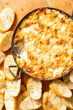 a skillet filled with cheese and bread chips