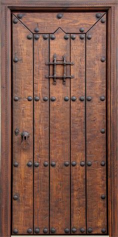 an old wooden door with metal handles