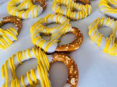 some pretzels with yellow and white icing on them