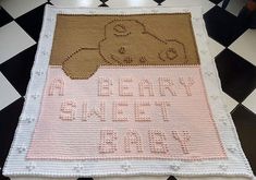 a crocheted baby blanket with a teddy bear on it that says, happy birth