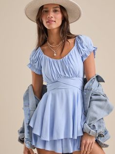 Cute and casual, this romper is featured in a fit and flare silhouette with a double layered skirt for optimal movement and puff sleeves and a bow back for all the added details. Layered Skirt