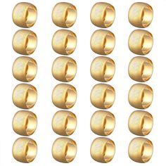 a set of gold screws on a white background