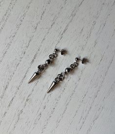 Stainless Steel Spike Drop Earrings - Etsy Hypoallergenic Punk Dangle Earrings, Hypoallergenic Dangle Earrings In Punk Style, Single Metal Earring For Streetwear, Edgy Nickel-free Dangle Plug Earrings, Edgy Silver Drop Earrings, Edgy Sterling Silver Dangle Earrings, Edgy Pierced Drop Earrings, Edgy Pierced Metal Earrings, Edgy Nickel-free Dangle Earrings