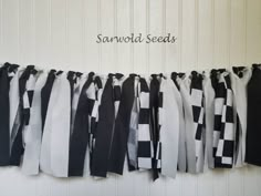 several black and white ribbons hanging on a wall with the words san francisco seeds written above them