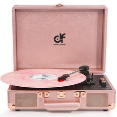 a pink suitcase with a record player in it