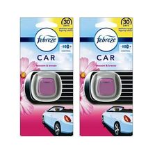 two packages of car air freshener sitting next to each other